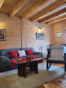 a living room with a couch and a table at Vacation Home Andjelic in Žabljak