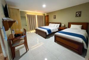 Postel nebo postele na pokoji v ubytování Apart Hotel Hamilton