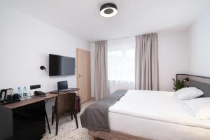 Postel nebo postele na pokoji v ubytování Antares Hotel
