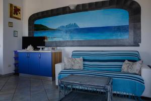 A seating area at Appartamenti Costa - BUDONI SWEET HOME