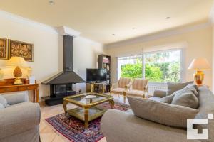 a living room with two couches and a fireplace at Villa Coral - Grupo Turis in Calpe