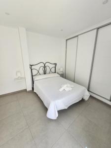 Łóżko lub łóżka w pokoju w obiekcie Apartamento Centro Ronda 2
