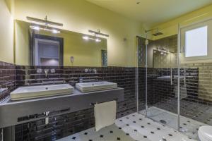 a bathroom with two sinks and a shower at Belle Boutique in Sliema