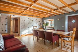 a dining room with a wooden table and chairs at The Shed in Durham