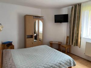 Letto o letti in una camera di Oskolok Dovbusha Mini-Hotel