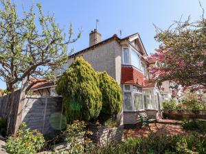 a house with a tree in front of it at Haffannedd in Colwyn Bay
