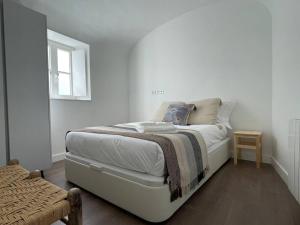 Postel nebo postele na pokoji v ubytování Casa da Travessa