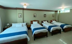 Postel nebo postele na pokoji v ubytování Apart Hotel Hamilton