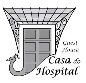 a guest house casa do ziekenhuis sign with a door bij Casa do Hospital-Guest House in Abaças