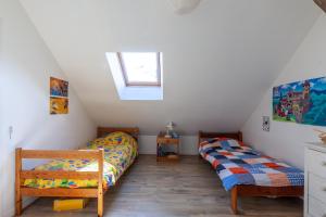 Postel nebo postele na pokoji v ubytování La Grange - Charmante maison à Langrune-sur-mer