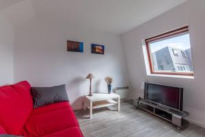 Televízia a/alebo spoločenská miestnosť v ubytovaní Duplex Croisette - Duplex à Bernières-sur-Mer