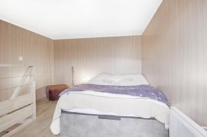 a bedroom with a large bed in a room at POP'S colors - Chalet dans les Vosges in Ventron