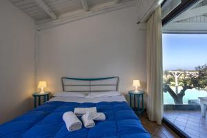 Posteľ alebo postele v izbe v ubytovaní Villa a Marsala con piscina