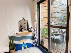 a room with blue and white stripes on the wall at 木子家民宿 in Magong