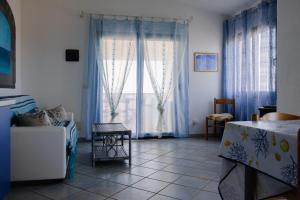 A seating area at Appartamenti Costa - BUDONI SWEET HOME