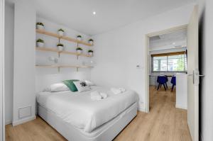 Posteľ alebo postele v izbe v ubytovaní Le Sant Salvador - Appartement près du canal
