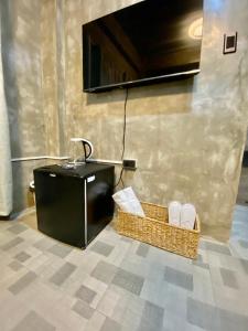 a room with a table and baskets on the floor at Hai Inn in Dumaguete +27 photos