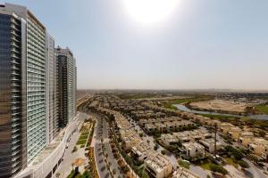 an aerial view of a city with tall buildings at Key View - Carson A, DAMAC Hills in Dubai Marina