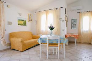 A seating area at Appartamenti Costa - BUDONI SWEET HOME