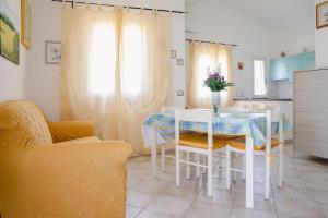 A seating area at Appartamenti Costa - BUDONI SWEET HOME