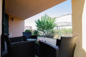 A seating area at Appartamenti Costa - BUDONI SWEET HOME