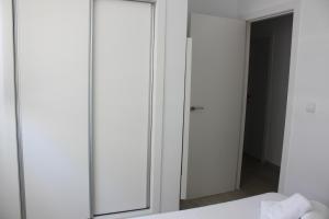 Posteľ alebo postele v izbe v ubytovaní Flamingo Solo Familias Serviplaya