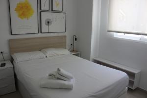 Posteľ alebo postele v izbe v ubytovaní Flamingo Solo Familias Serviplaya + 32 fotografií