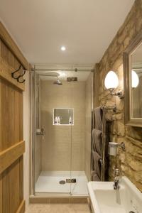 a bathroom with a shower and a sink at The Royal Oak Tetbury in Tetbury