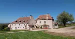 a large white building with a red roof at Vauban in Asquins