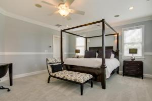 1 dormitorio con cama con dosel y silla en Spacious Ocean City Home - Walk to Beach!, en Ocean City