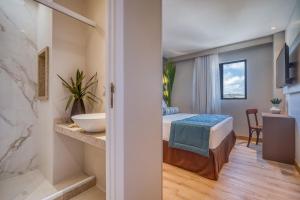 Postel nebo postele na pokoji v ubytování Hotel Água de Coco