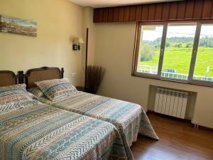 Ένα ή περισσότερα κρεβάτια σε δωμάτιο στο Villa Amelia