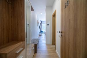a hallway with a door and a bench in a room at Andjela's Studio in Kotor