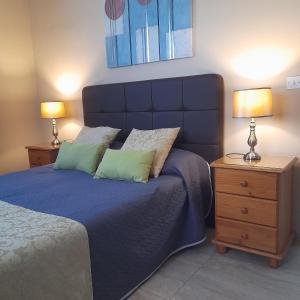 Postel nebo postele na pokoji v ubytování aloha apartments