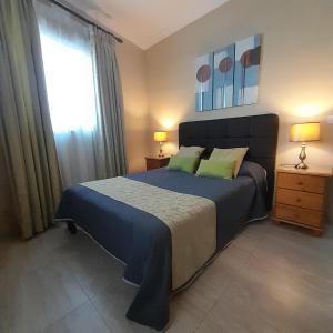 Postel nebo postele na pokoji v ubytování aloha apartments
