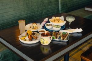 a table with several plates of food on it at San Jose Marriott in San Jose