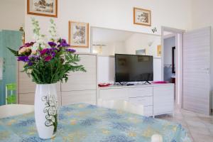 A kitchen or kitchenette at Appartamenti Costa - BUDONI SWEET HOME