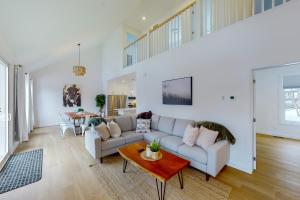 a living room with a couch and a table at The Cottages at Blue in Blue Mountains