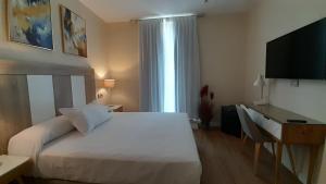 Posteľ alebo postele v izbe v ubytovaní Olivae Hostal Boutique