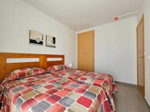 Posteľ alebo postele v izbe v ubytovaní Realrent Neo Mediterráneo
