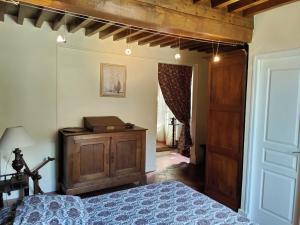 Postel nebo postele na pokoji v ubytování La ferme des douceurs