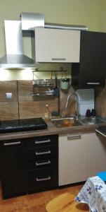 a kitchen with a sink and a counter top at VIP in Ahtopol