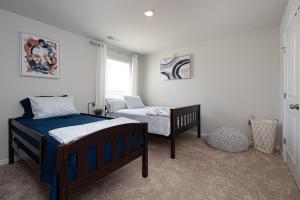 a bedroom with two beds and a window at Endless Summer Rental in Millville +26 photos