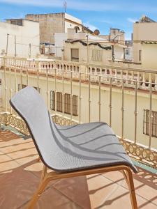 a chair sitting on the roof of a building at Apartamentos Turquesa La Carihuela in Torremolinos