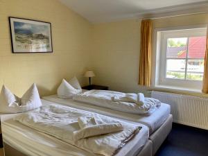 Postel nebo postele na pokoji v ubytování Villa Edda - Ferienwohnung 01