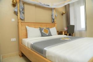 Postel nebo postele na pokoji v ubytování Jade Hotel