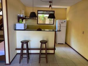 A cozinha ou cozinha compacta de Chalés Mirante de Pipa