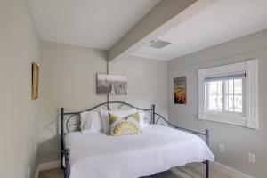 a bedroom with a bed and a window at Historic Downtown Gem - Walk to Everything! in Fredericksburg