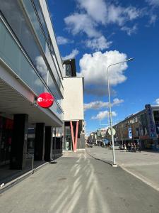 an empty city street with a stop sign on a building at Kuopio in the City in Kuopio