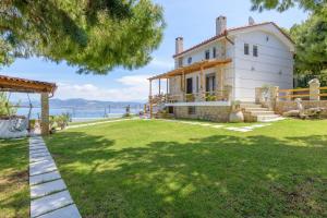 a house with a view of the water at Crystal Beach Villa in Chalkida